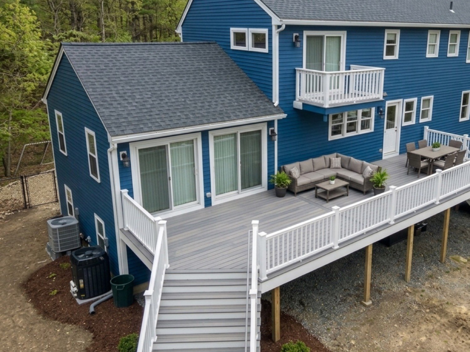 Whole-home renovation with rear addition and composite deck